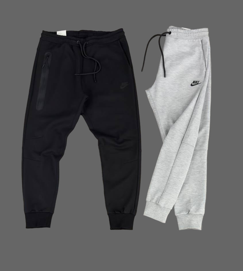 Pantaloni Nike Tech Fleece pentru bărbați, gri clasic, cu buzunar cu fermoar pe piciorul drept